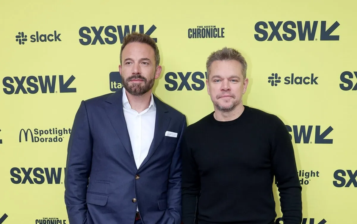 Ben Affleck and Matt Damon posing at the premiere of 'Air'.