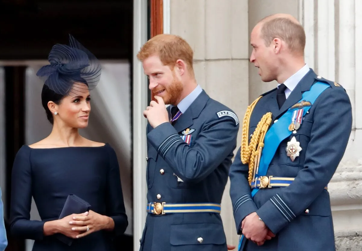 Meghan Markle, Prince Harry, and Prince William watch a flypast from the balcony of Buckingham Palace