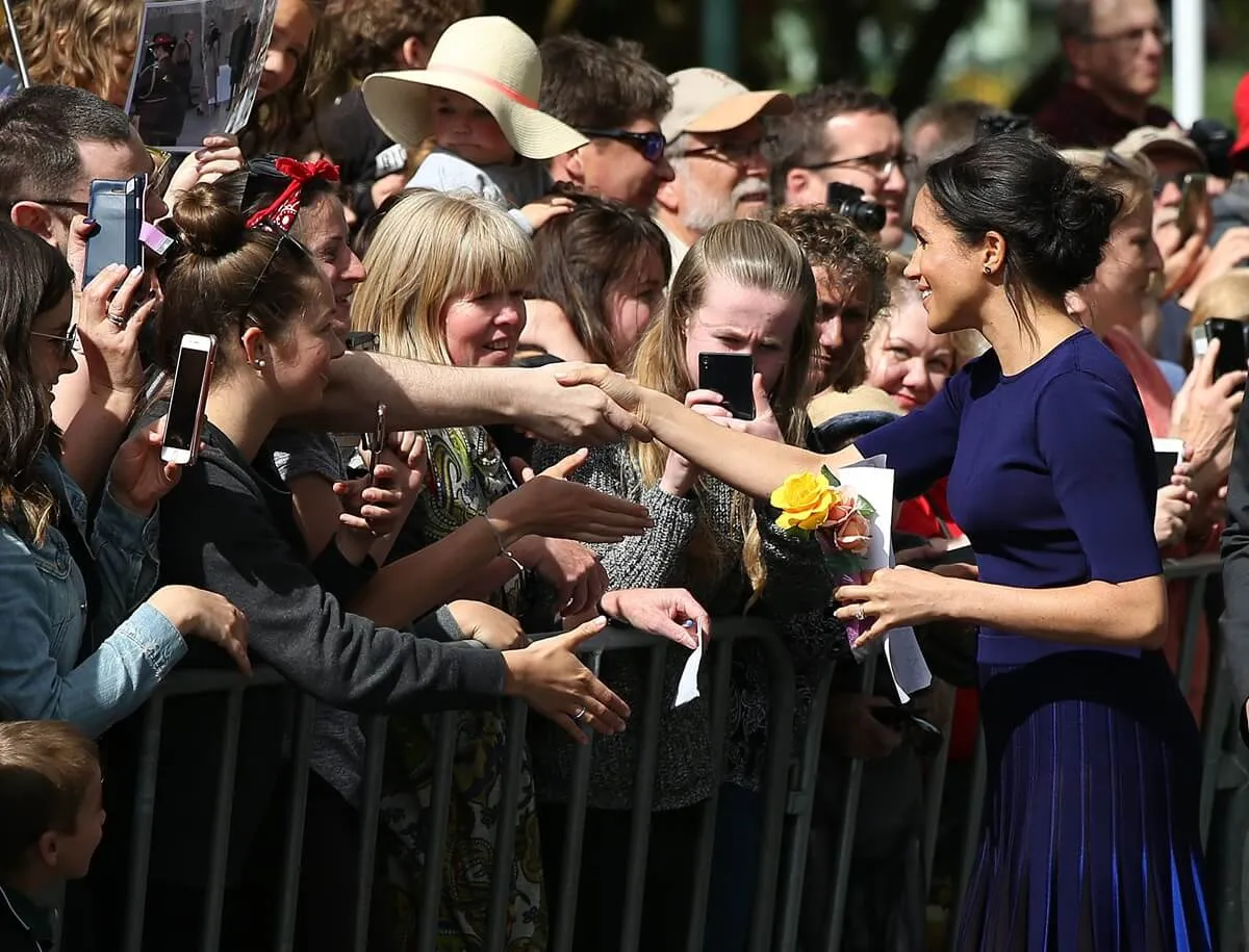 Meghan Markle meets members of the public during a walkabout at Rotorua Government Gardens, New Zealand