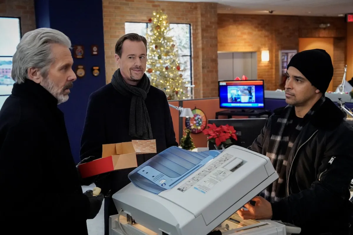 Parker, McGee, and Torres standing in front of a Christmas tree in 'NCIS' Season 22 holiday episode