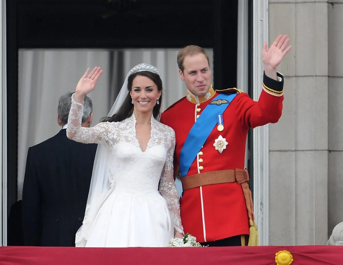 Prince William and Kate Middleton wave to well-wishers from the balcony at Buckingham Palace following their royal wedding