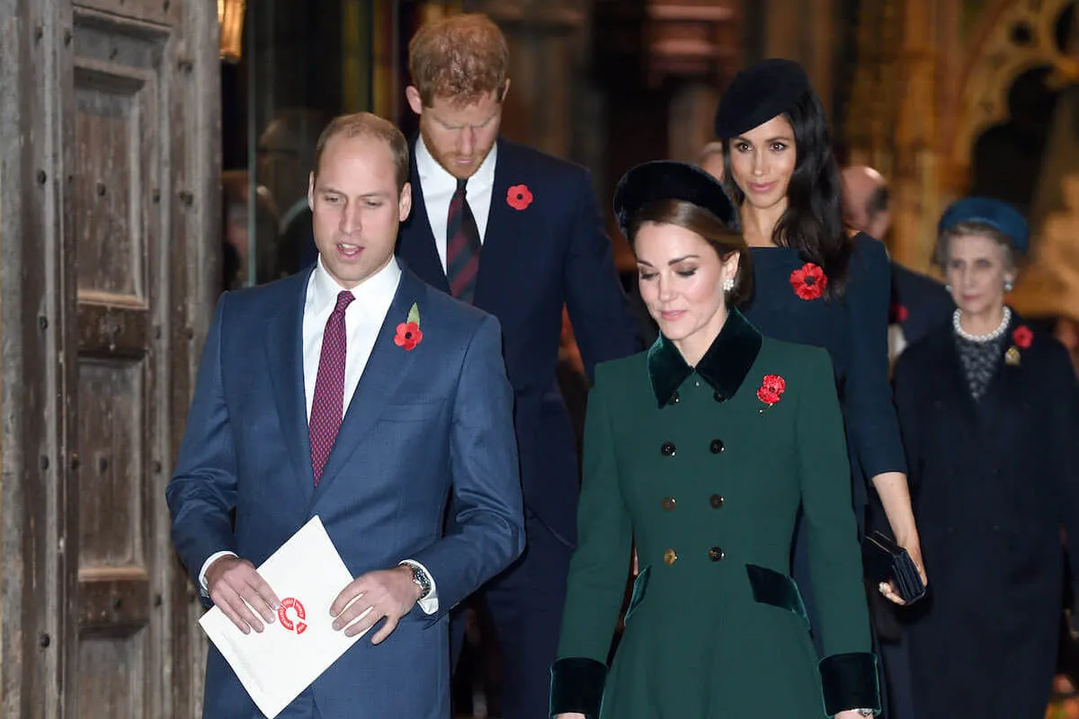 Prince William and Kate Middleton, who have a U.S. plan for expanding their charity, walk in front of Prince Harry and Meghan Markle