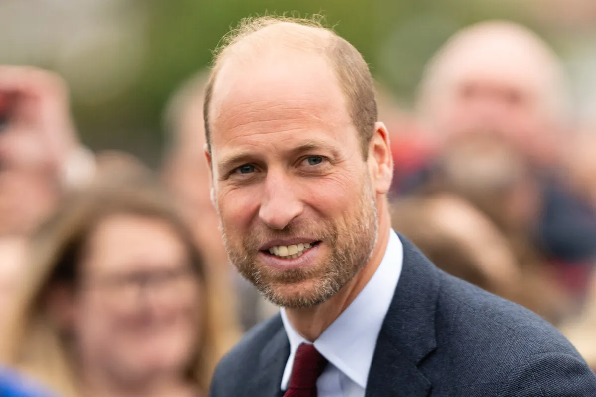 Prince William, whose homelessness documentary will be available to watch in the U.S., smiles and looks on