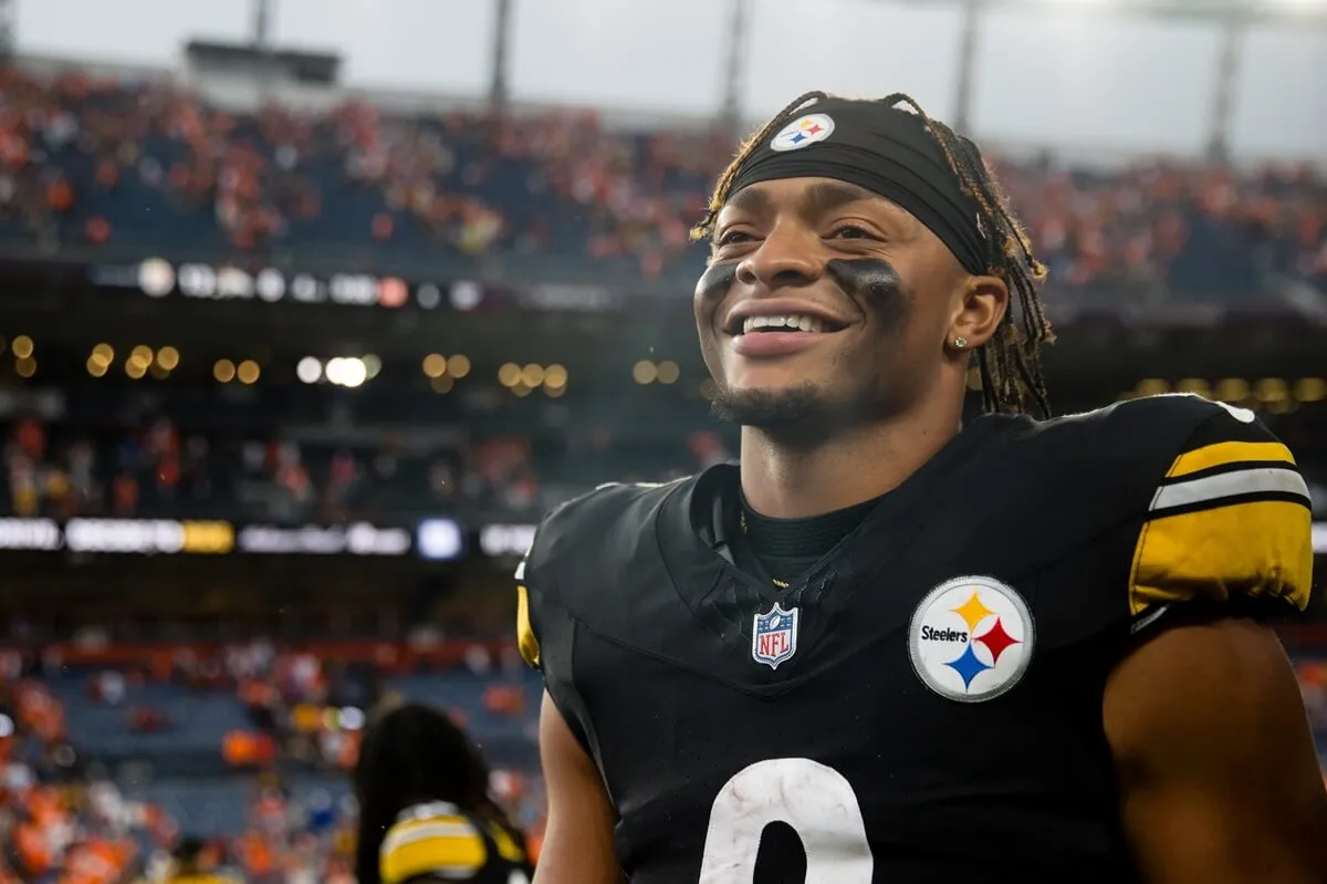 Quarterback Justin Fields of the Pittsburgh Steelers smiles after a win against the Denver Broncos