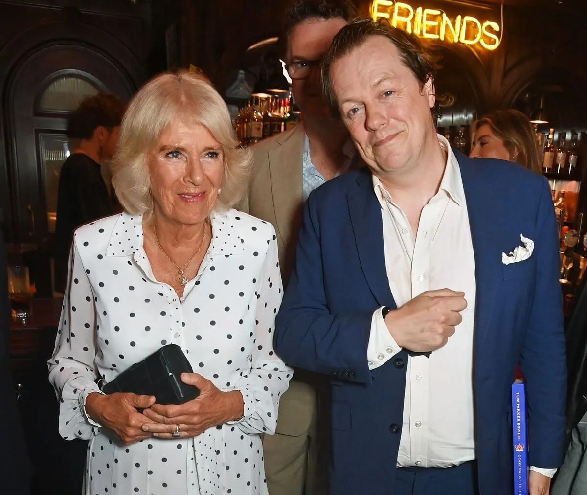 Queen Camilla and Tom Parker Bowles attend the launch of new book 'Cooking & The Crown'