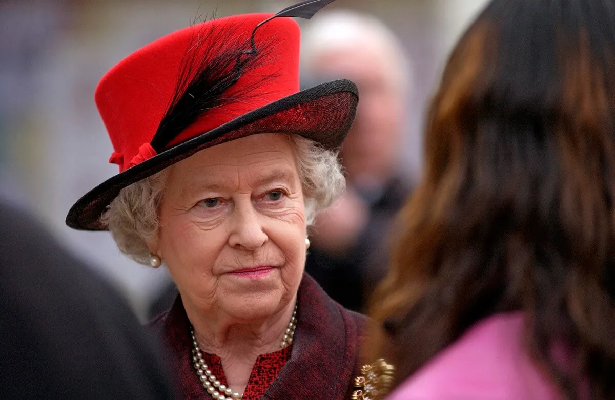 Queen Elizabeth II speaking with people during visit to Essex University