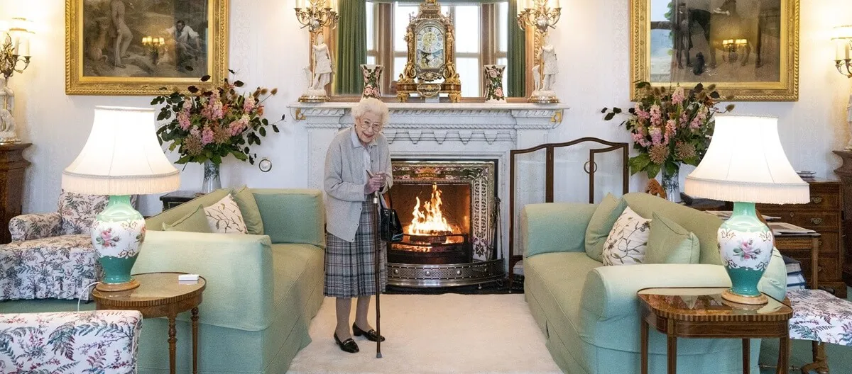 Queen Elizabeth II waits in the Drawing Room before receiving newly elected leader of the Conservative party Liz Truss at Balmoral Castle