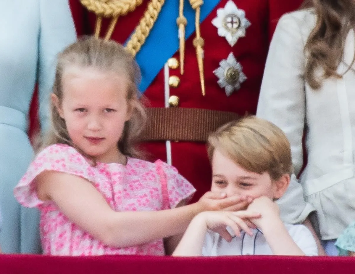 Savannah Phillips and Prince George on the balcony of Buckingham Palace during Trooping The Colour