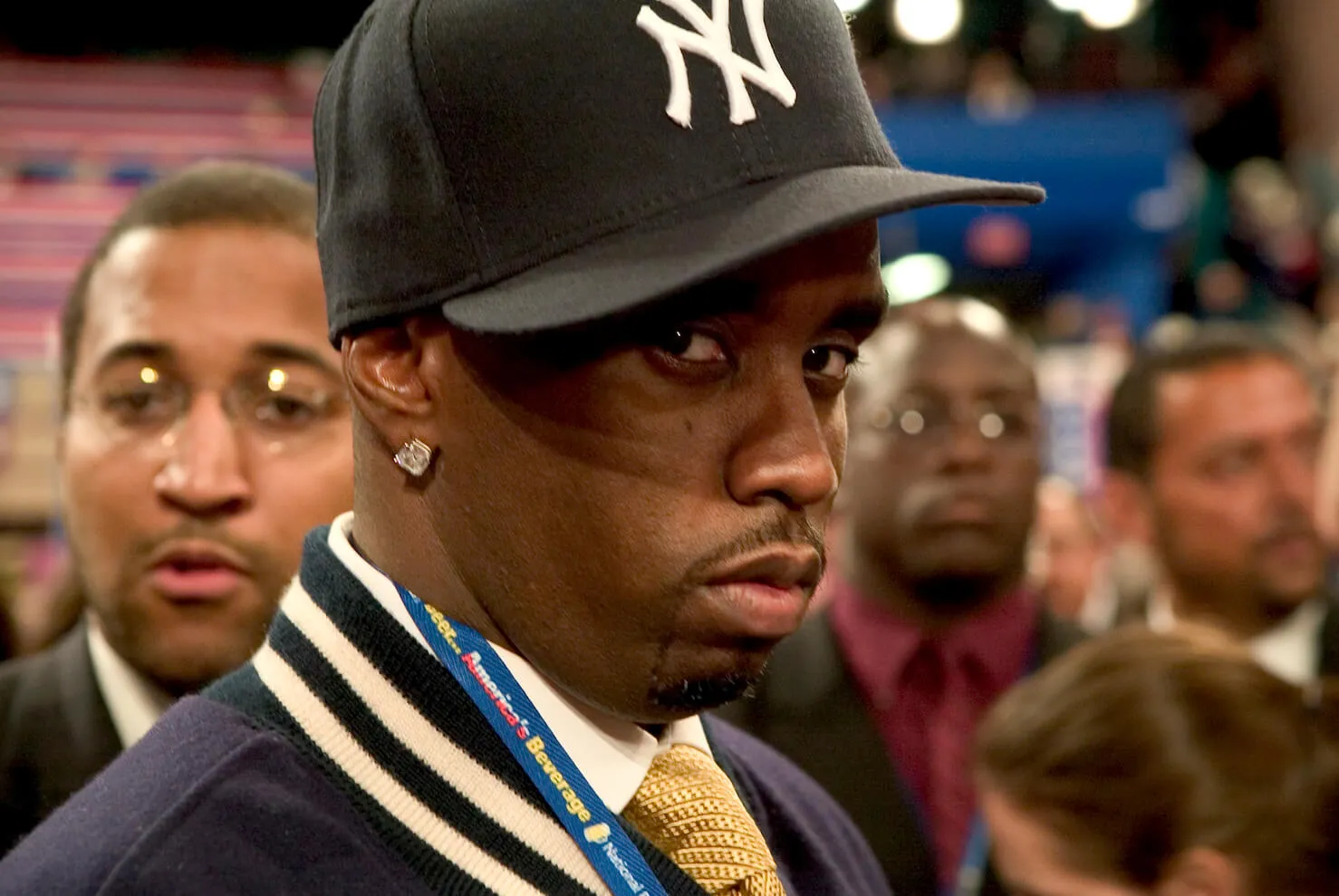 A close-up of Sean 'Diddy' Combs with a Yankees cap on. He's staring at the camera.