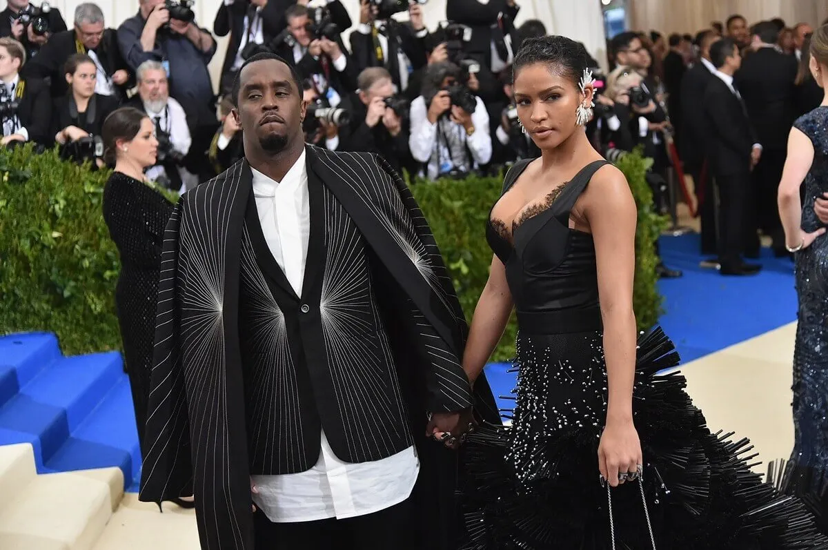 Sean 'Diddy' Combs and Cassie posing in matching-colored outfits at the "Rei Kawakubo/Comme des Garcons: Art Of The In-Between".