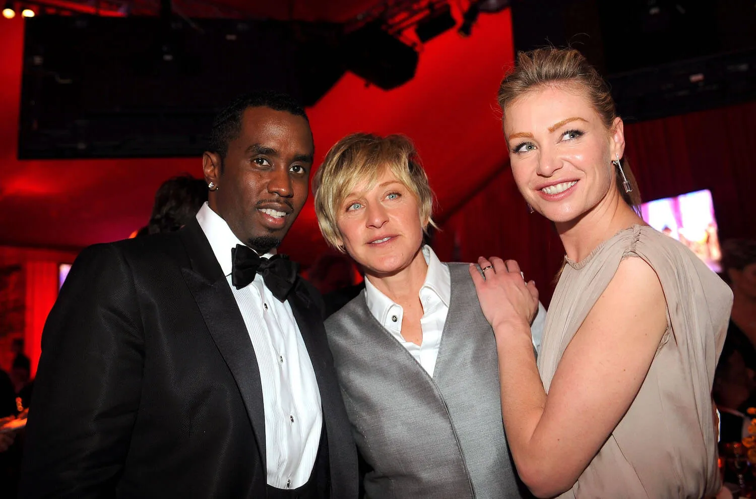 Sean 'Diddy' Combs, Ellen DeGeneres, and Portia de Rossi posing together at an event in 2008