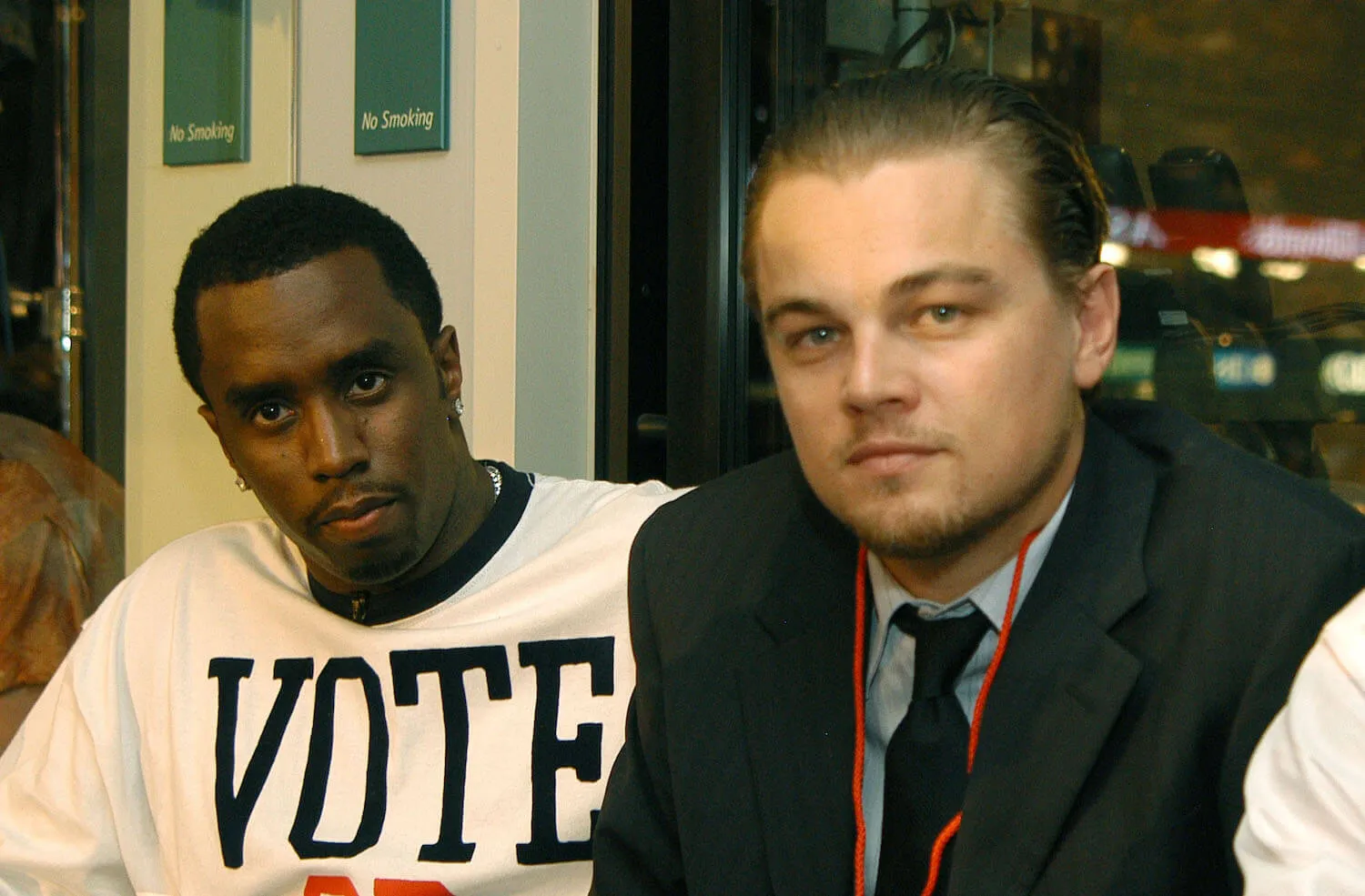 Sean 'Diddy' Combs and Leonardo DiCaprio sitting side by side at the Democratic National Convention in 2004