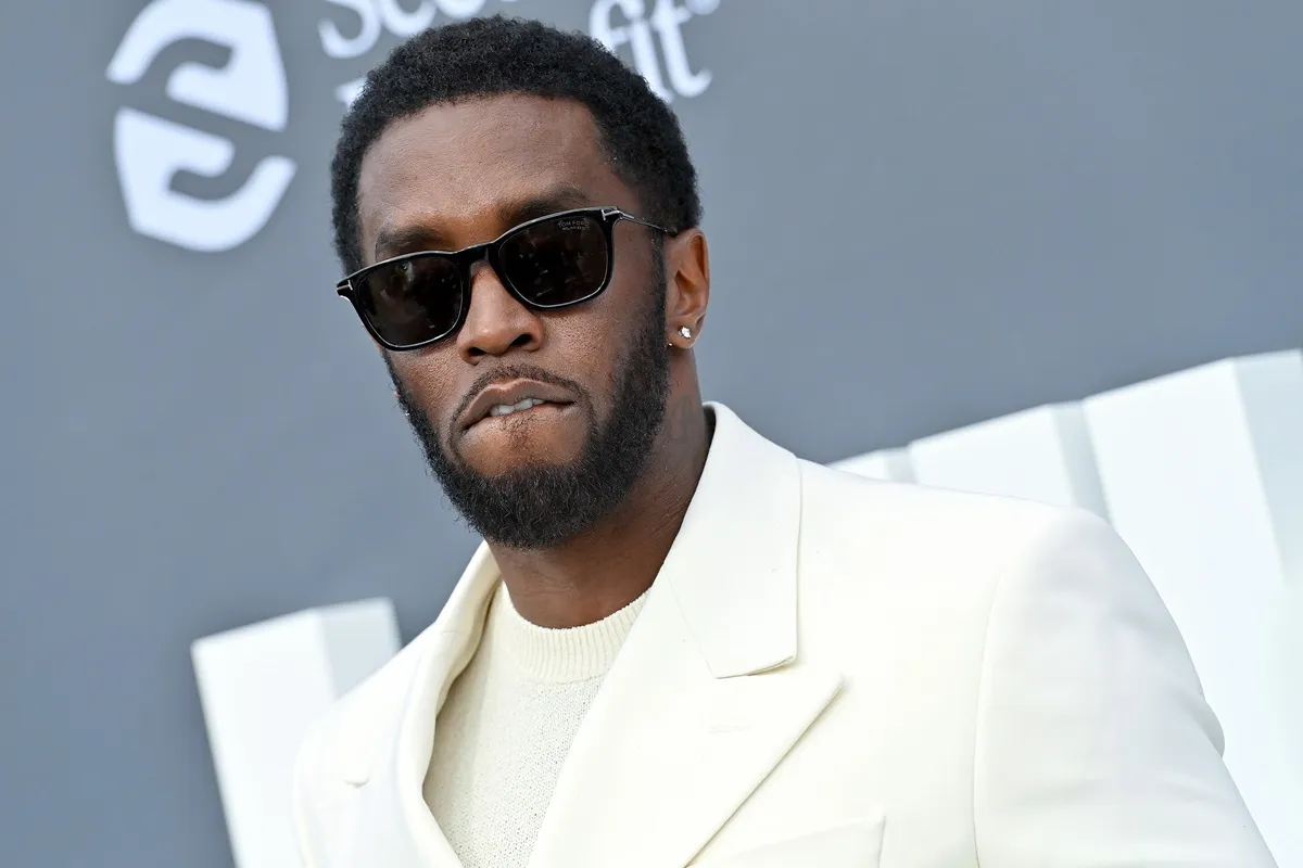 Sean 'Diddy' Combs poses in a white suit at the 2022 Billboard Music Awards at the MGM Grand Garden Arena.