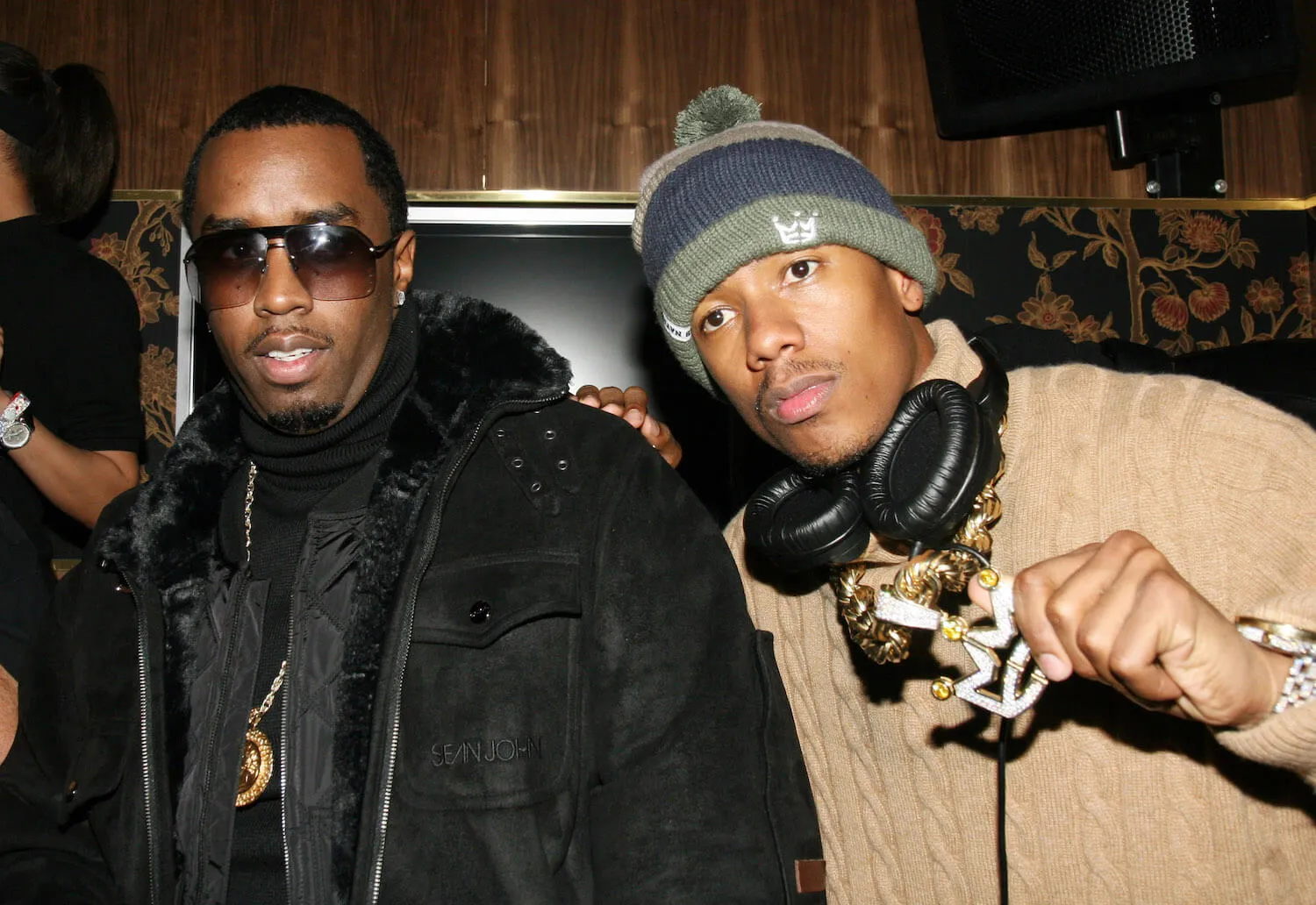 Sean 'Diddy' Combs and Nick Cannon posing together at a party in 2007.