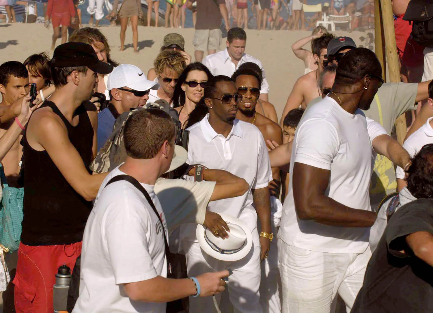 Sean 'Diddy' Combs' White Party in 2006. He's surrounded by partygoers in white. 