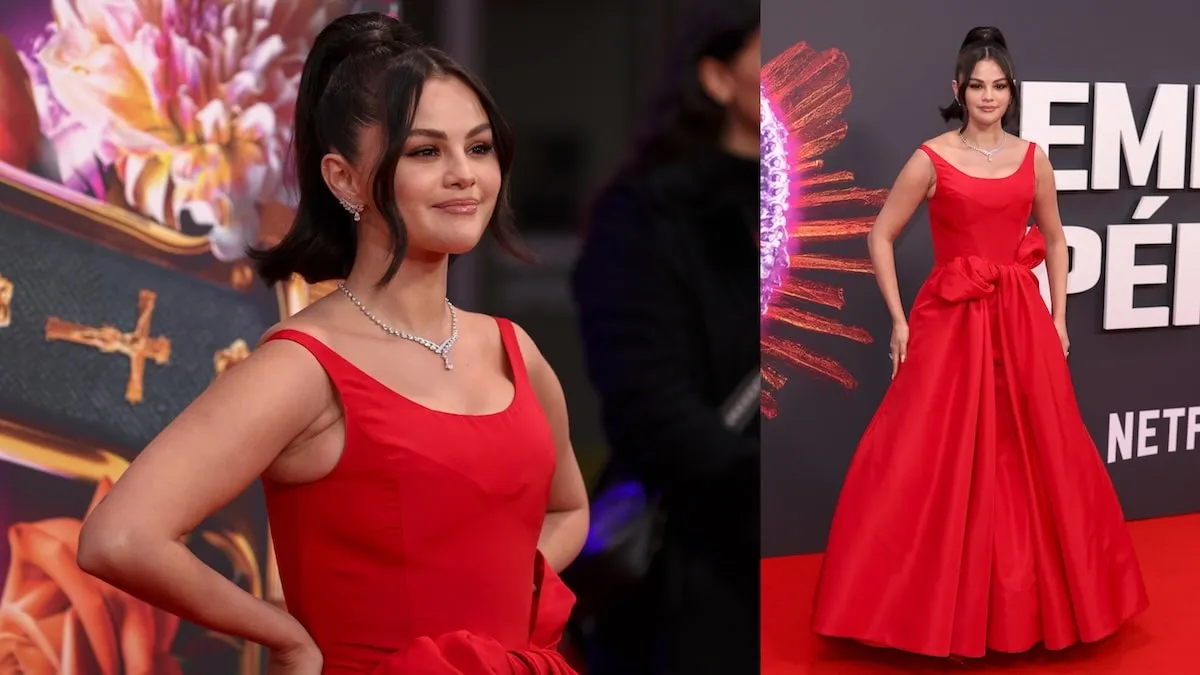 Wearing a red structured gown, Selena Gomez stands on the red carpet at the 'Emilia Perez' Headline Gala