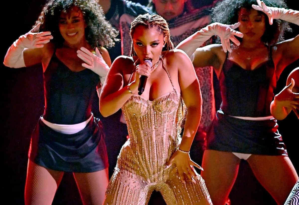 Wearing a gold bodysuit, Chloe Bailey performs on stage at the BET Awards