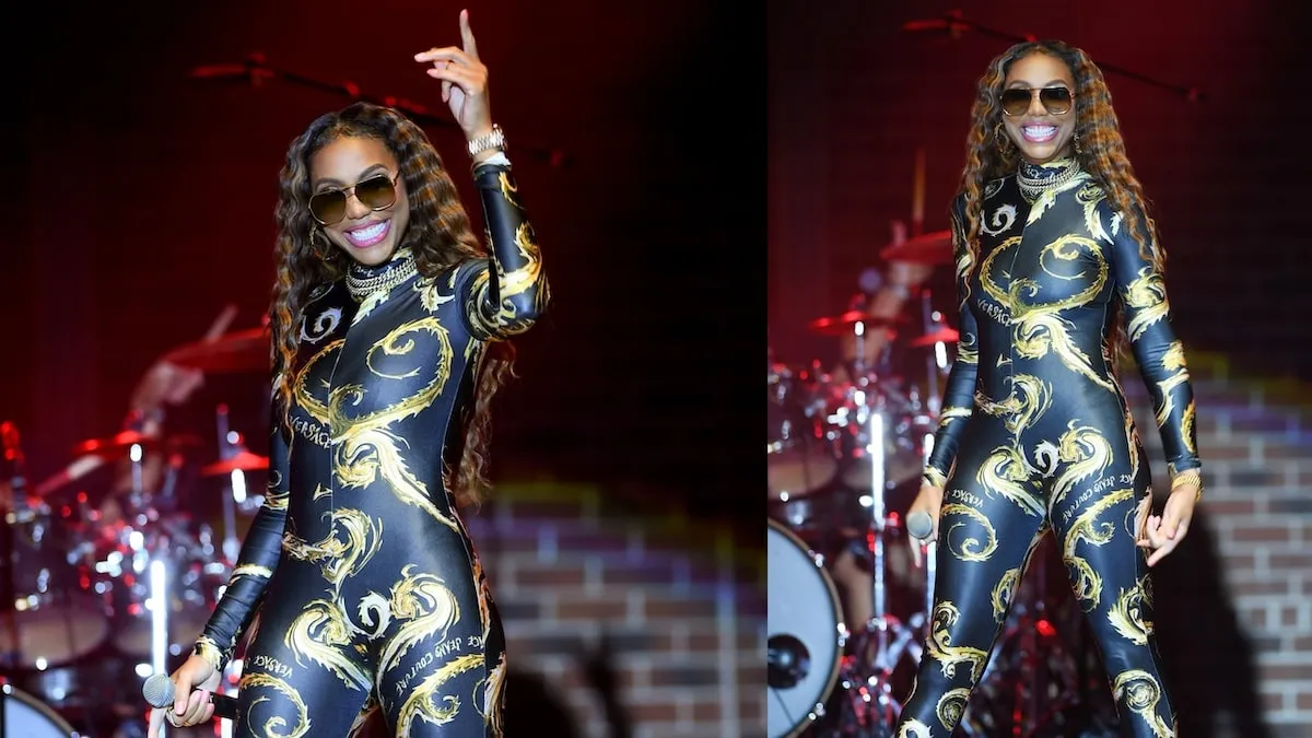 Wearing a Versace bodysuit, singer Tamar Braxton performs onstage in 2024