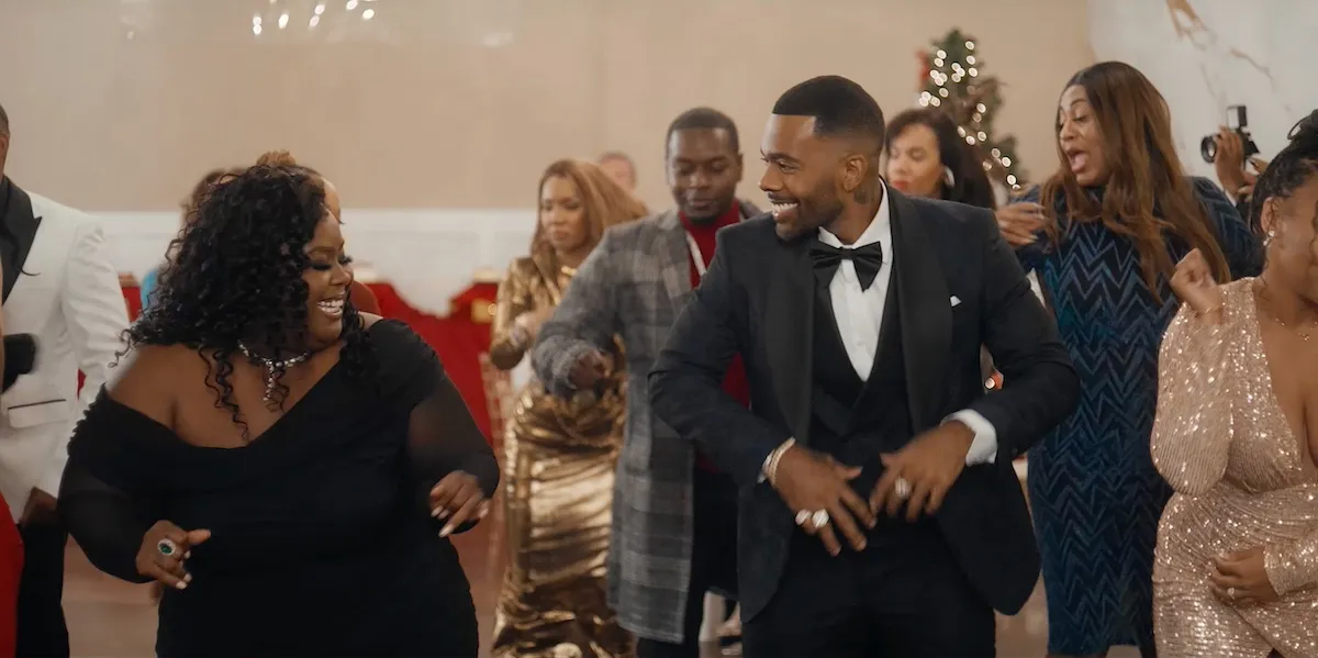 Two people dancing in the BET+ movie 'Style Me for Christmas'