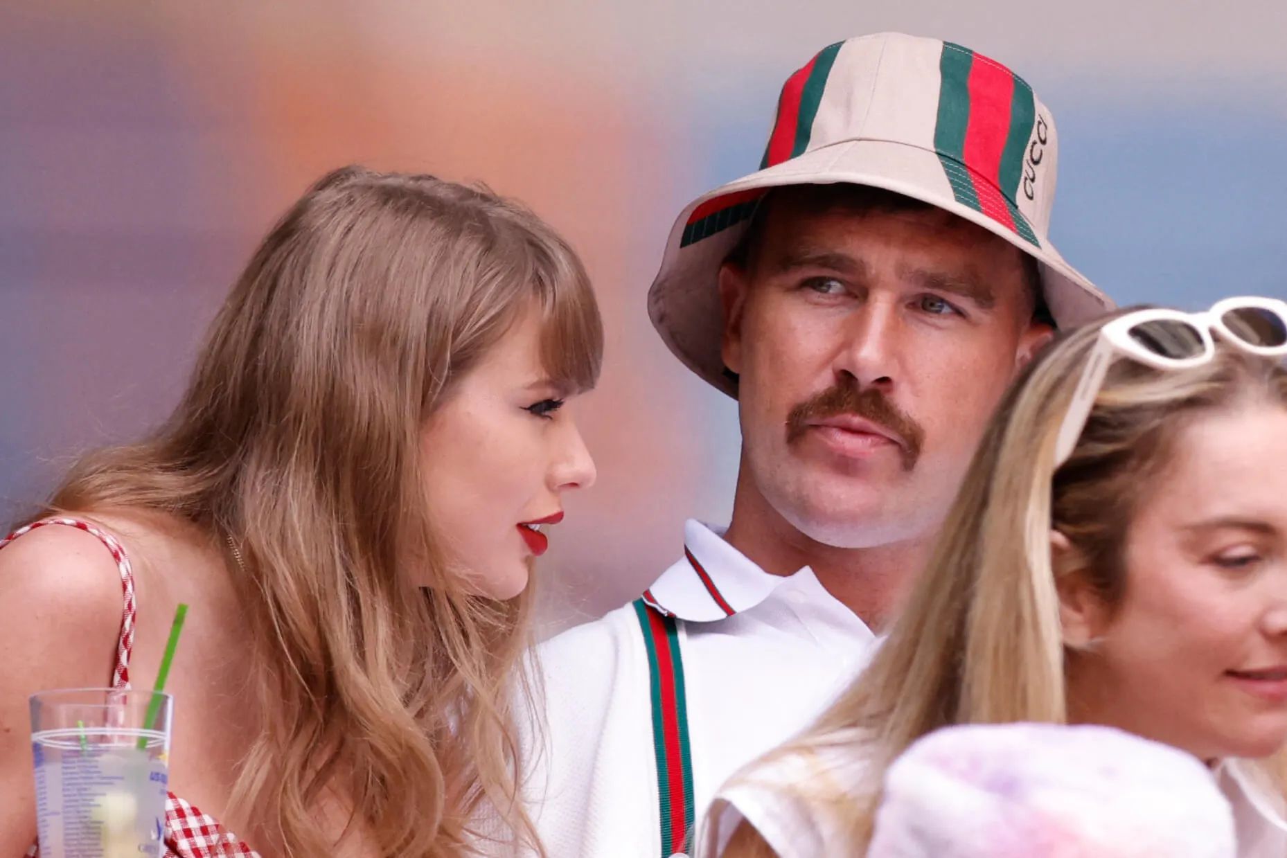 A close-up of Taylor Swift leaning into Travis Kelce at the US Open in September 2024.