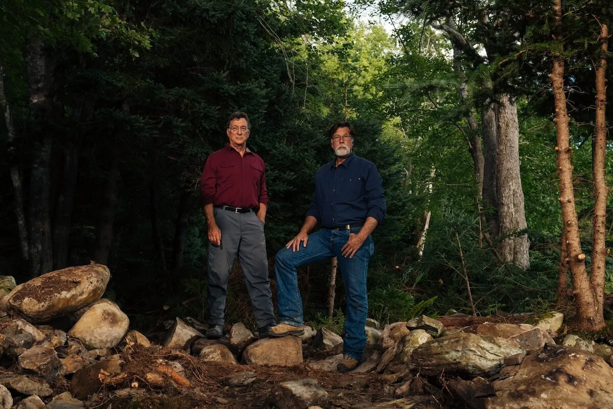 Rick and Marty Lagina standing among trees in 'The Curse of Oak Island'