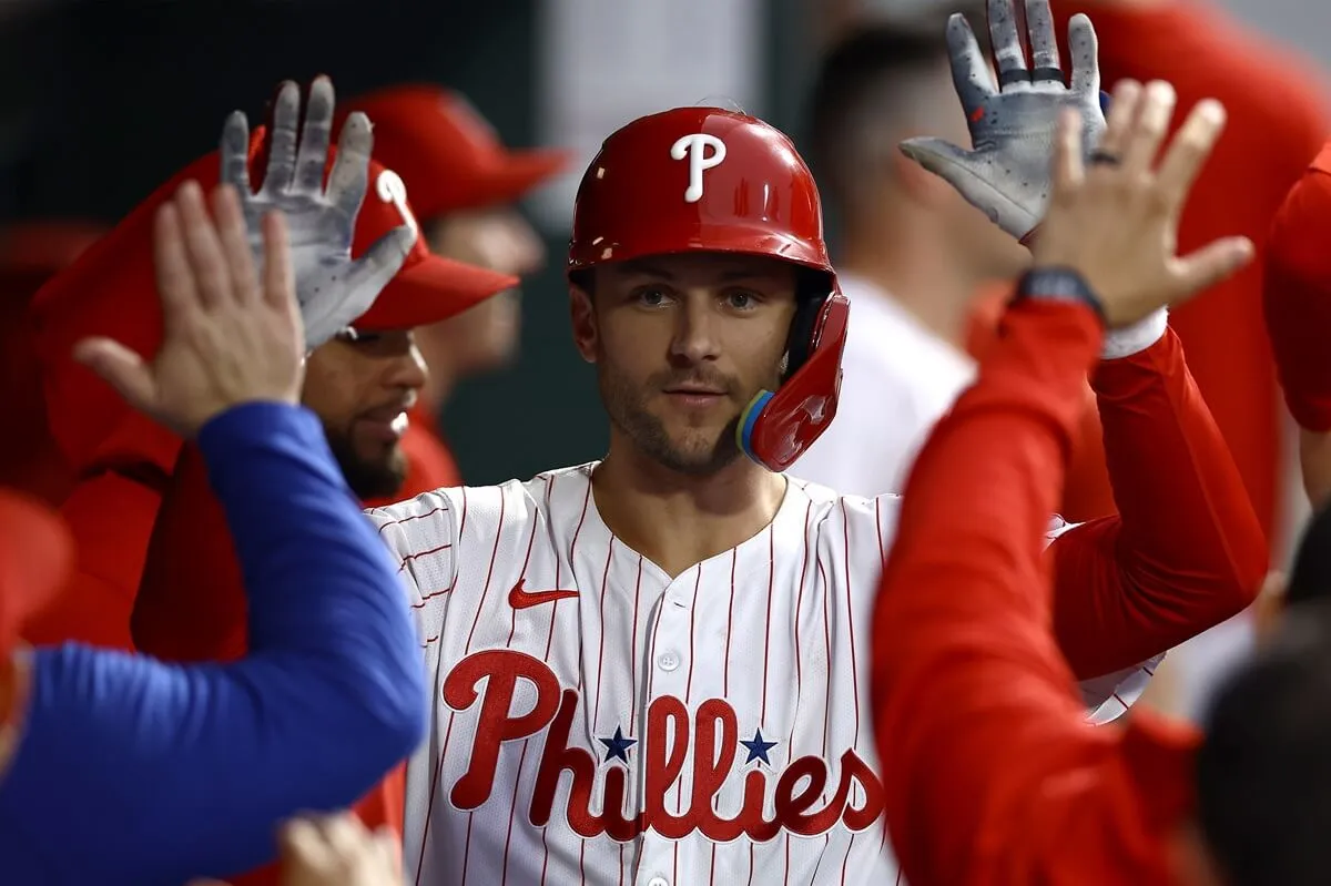 Trea Turner of the Philadelphia Phillies reacts with teammates after hitting a solo home run