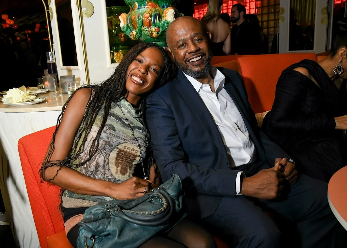 Forest Whitaker sits on a couch and smiles with his daughter, True, during a 'Dune: Prophecy' afterparty