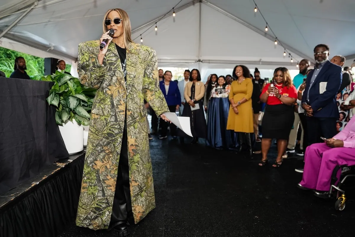 Wearing an oversized camouflage suit, Ciara speaks at a VIP Reception before a When We All Vote rally in Georgia