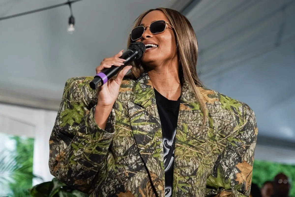 Wearing an oversized camouflage suit, Ciara speaks at a VIP Reception before a When We All Vote rally in Georgia