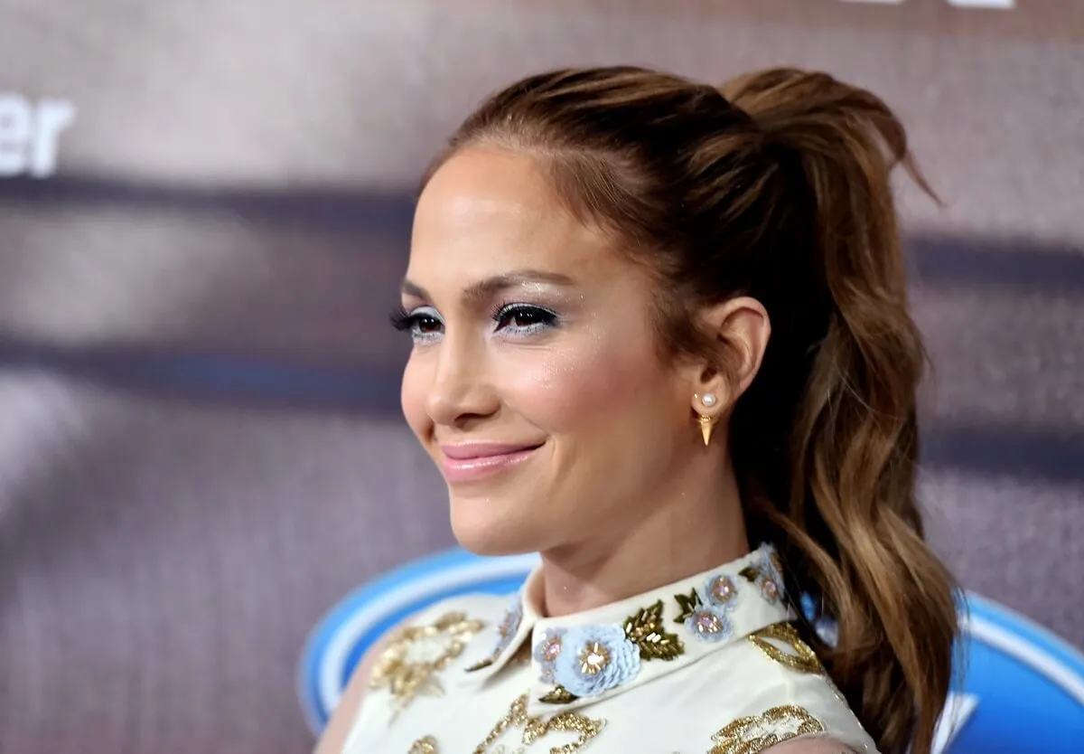 Jennifer Lopez smiling while attending an 'American Idol' finalist party.