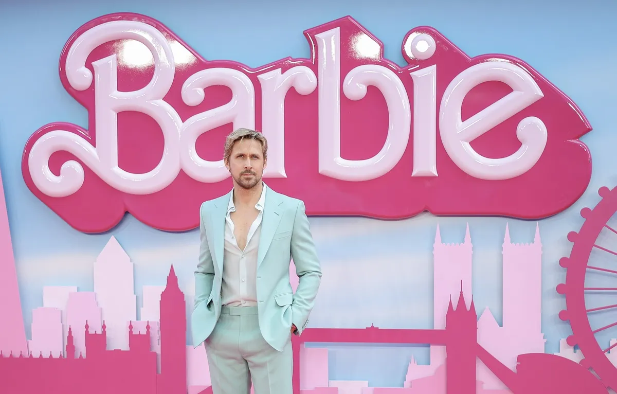 Ryan Gosling posing in a blue suit at the premiere of 'Barbie'