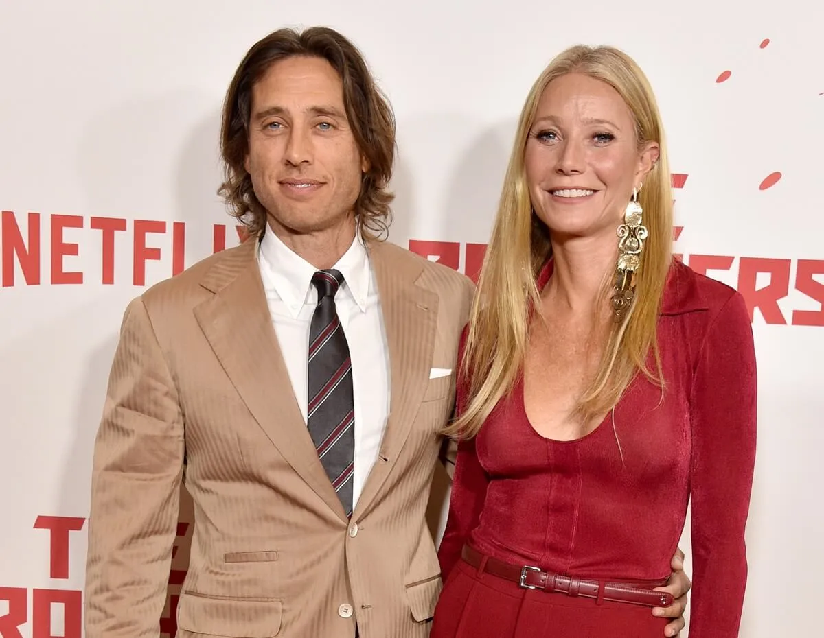 Gwyneth Paltrow posing alongside Brad Falchuk at the Los Angeles Premiere Of Netflix's "The Brothers Sun".