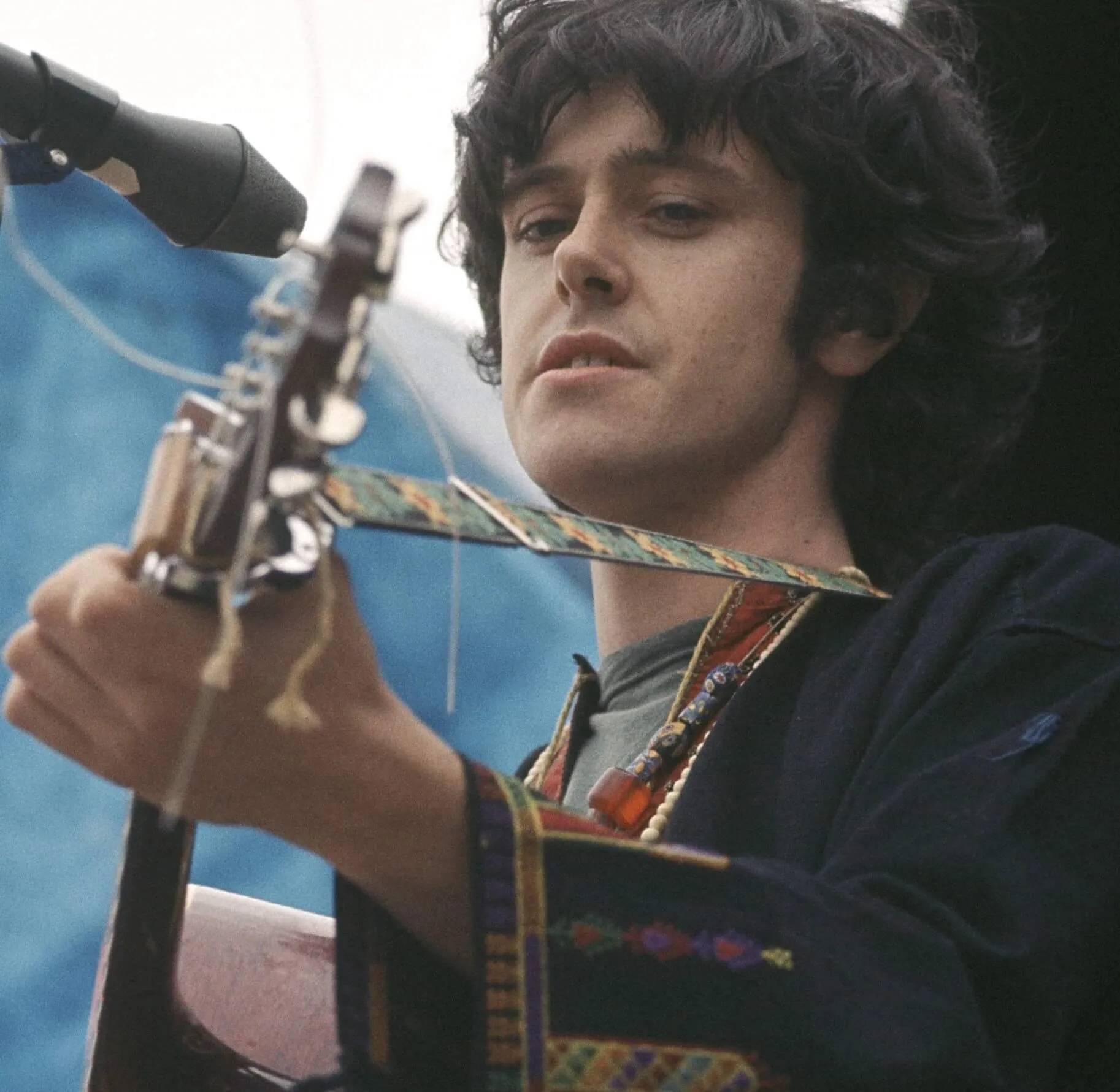 "Season of the Witch" singer Donovan star with a guitar