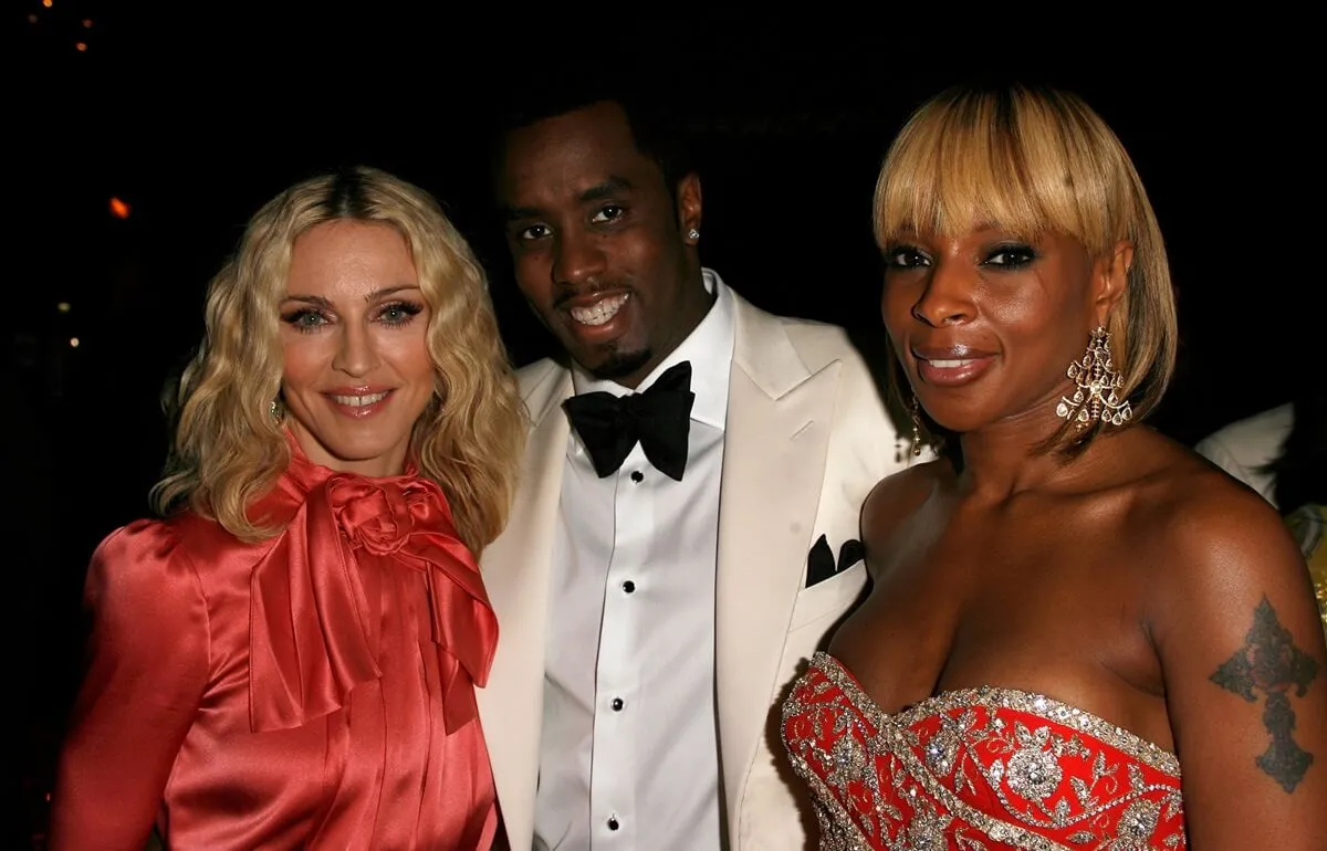 Madonna posing with Sean Diddy Combs and Mary J. Blige.