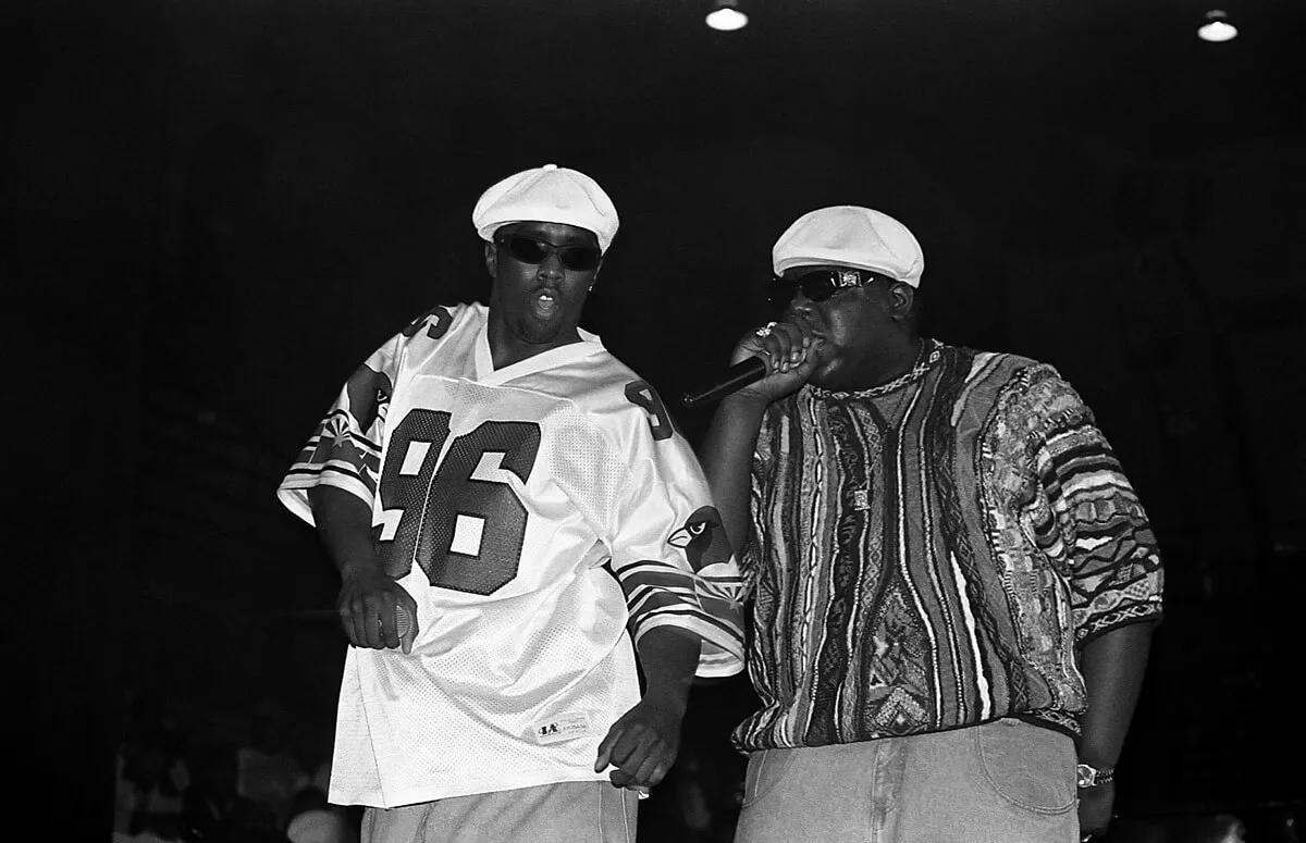 Sean 'Diddy' Combs and Biggie Smalls performing at a live concert.