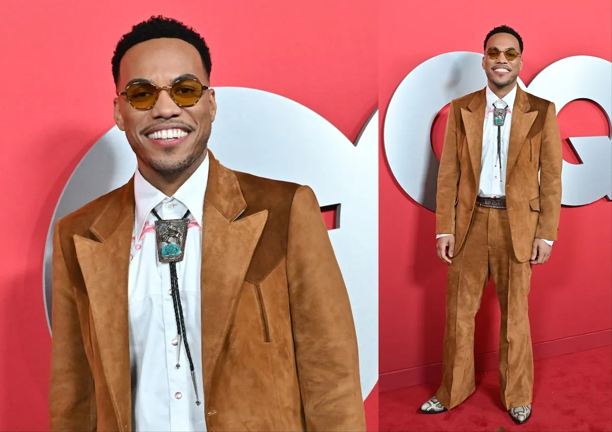 Wearing a suede suit set and bolo tie, Anderson .Paak poses for photos on the red carpet at the 2024 GQ Men Of The Year Party