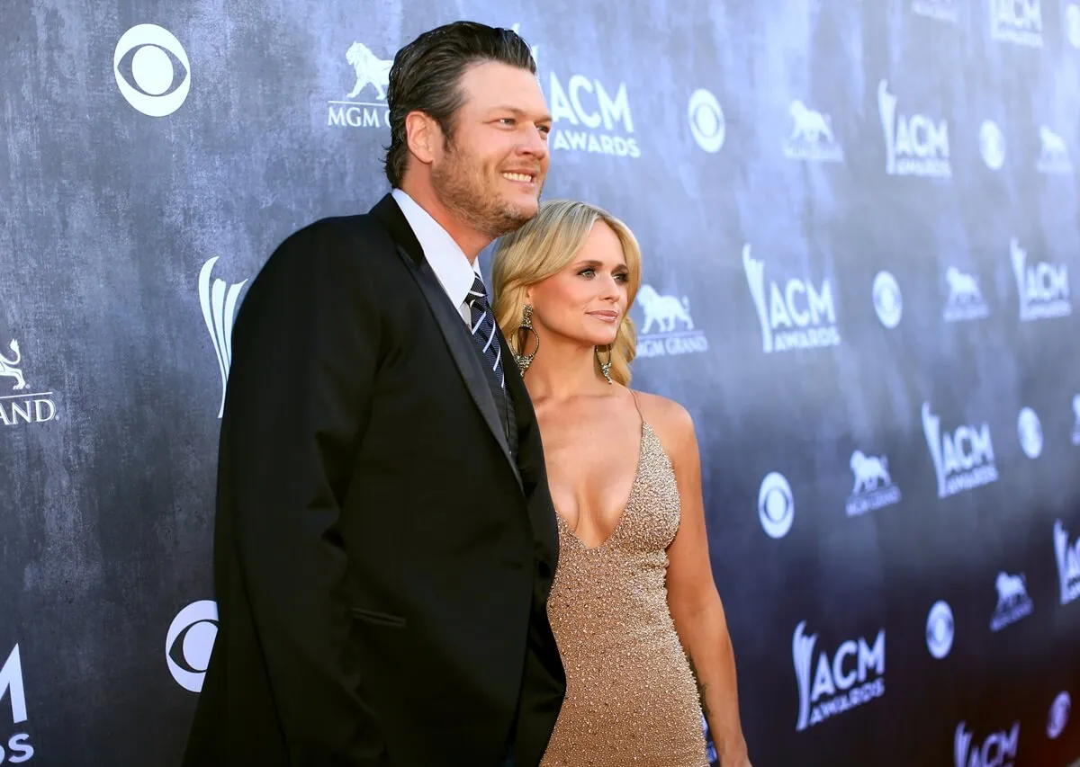 Blake Shelton and Miranda Lambert attend the 49th Annual Academy of Country Music Awards wearing a suit and gold dress respectively.