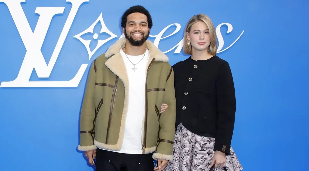 Caleb Williams and Alina Thyregod attend the Louis Vuitton Menswear Spring-Summer 2025 show as part of Paris Fashion Week