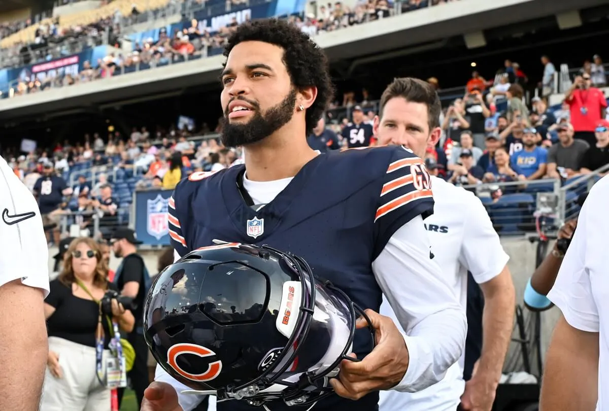 Caleb Williams of the Chicago Bears walks onto the field prior to the 2024 Pro Football Hall of Fame Game against the Houston Texans