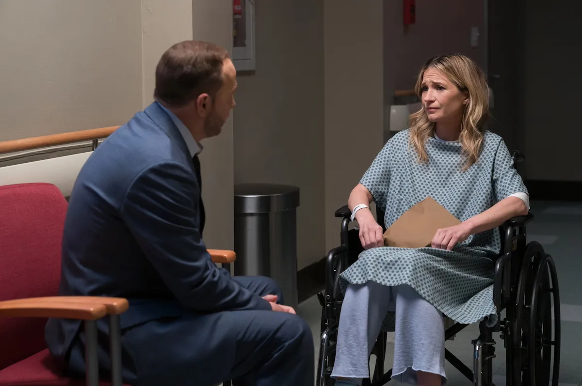 Donnie Wahlberg talks to Vanessa Ray, who is in a wheelchair, in the 'Blue Bloods' series finale