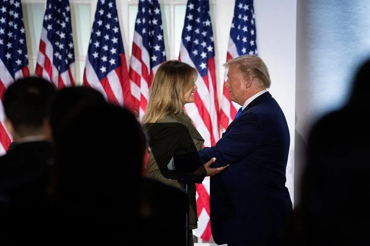 Donald Trump about to embrace first lady Melania Trump after her remarks in the White House Rose Garden