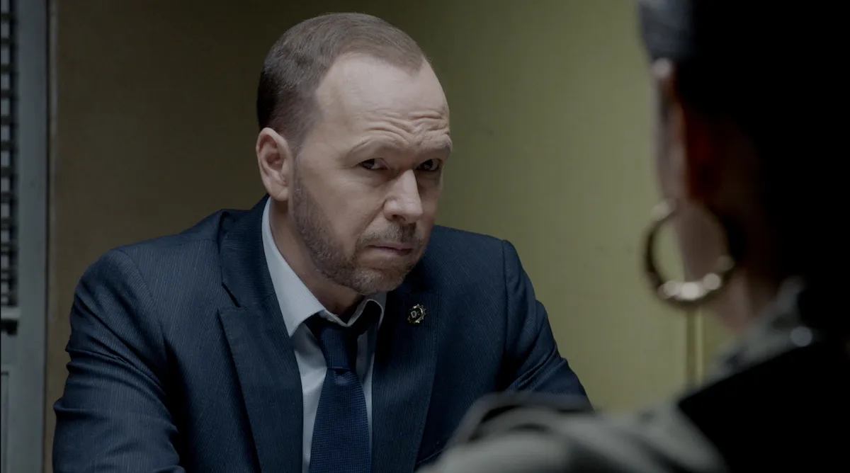 Donnie Wahlberg wearing a suit and tie and looking series in 'Blue Bloods' Season 14