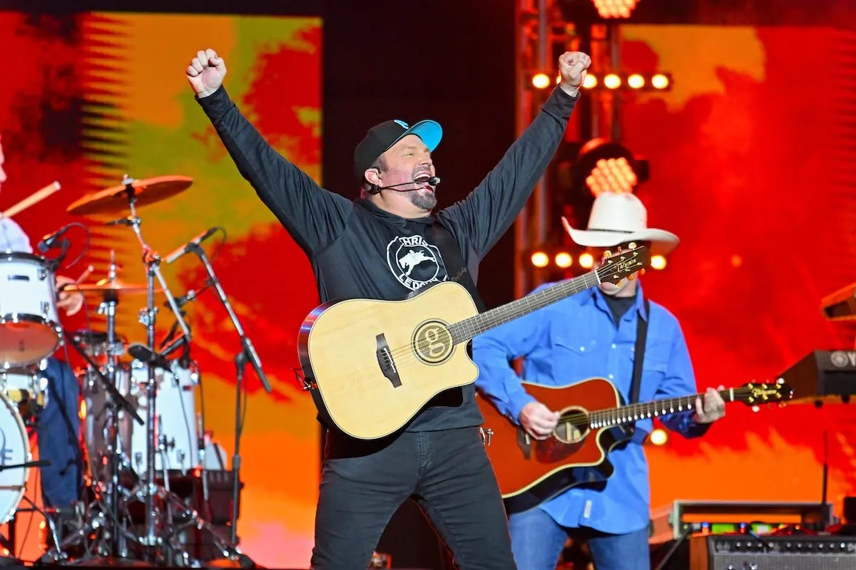 Wearing a black sweatshirt and jeans, Garth Brooks performs for fans on Jimmy Kimmel Live