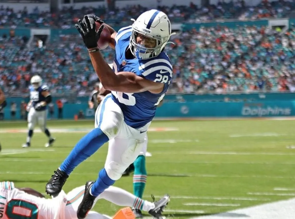 Indianapolis Colts Jonathan Taylor dives into endzone for touchdown against the Miami Dolphins