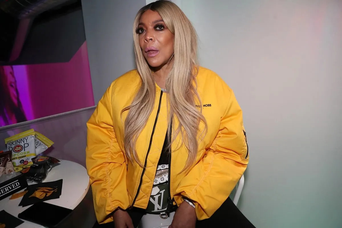 Wendy Williams at the "New Cash Order" Documentary Screening while wearing a yellow coat.