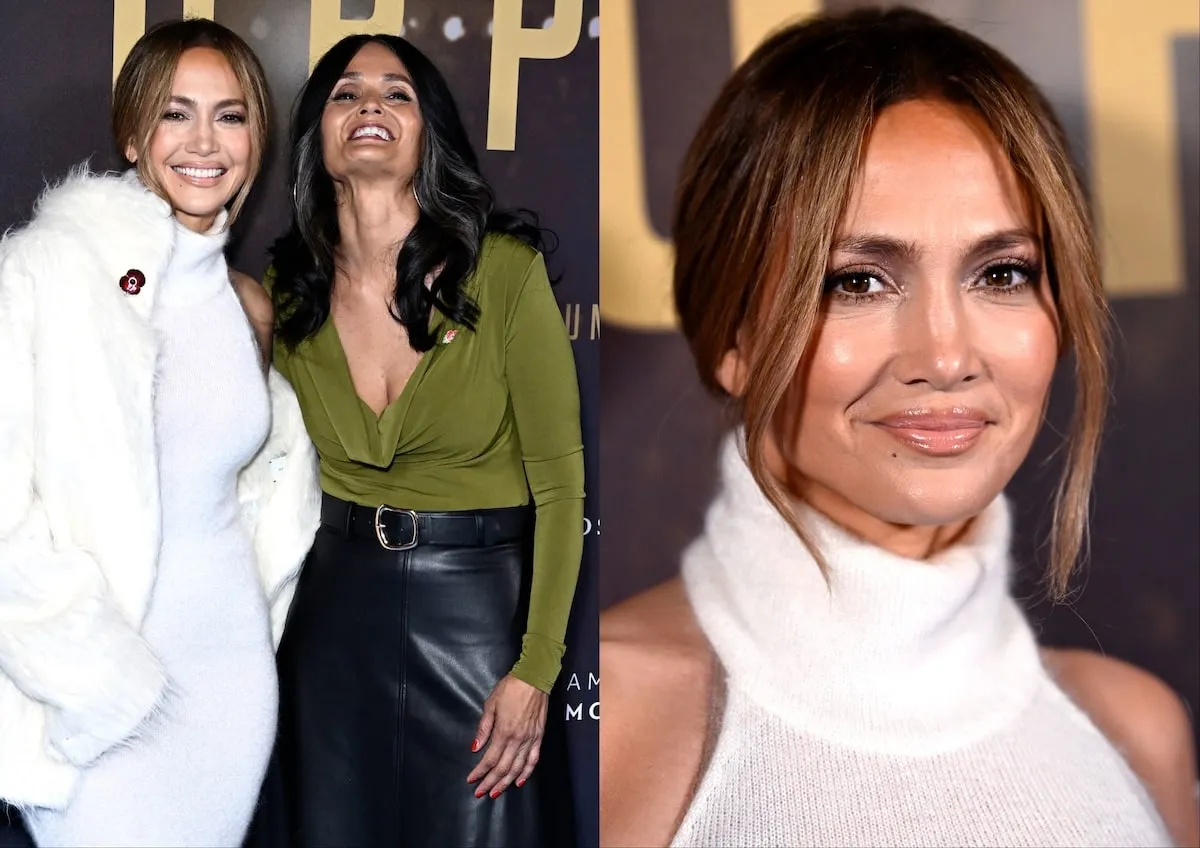 Wearing a white coat and white sweater dress, Jennifer Lopez poses with Judy Robles on the red carpet before the UK premiere of 'Unstoppable'