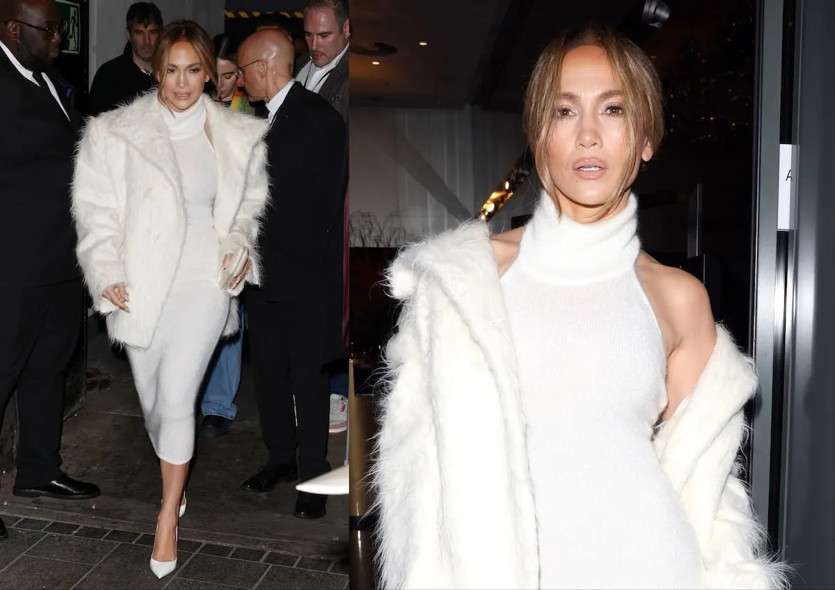 Wearing a white coat and white sweater dress, Jennifer Lopez poses on the red carpet before the UK premiere of 'Unstoppable'