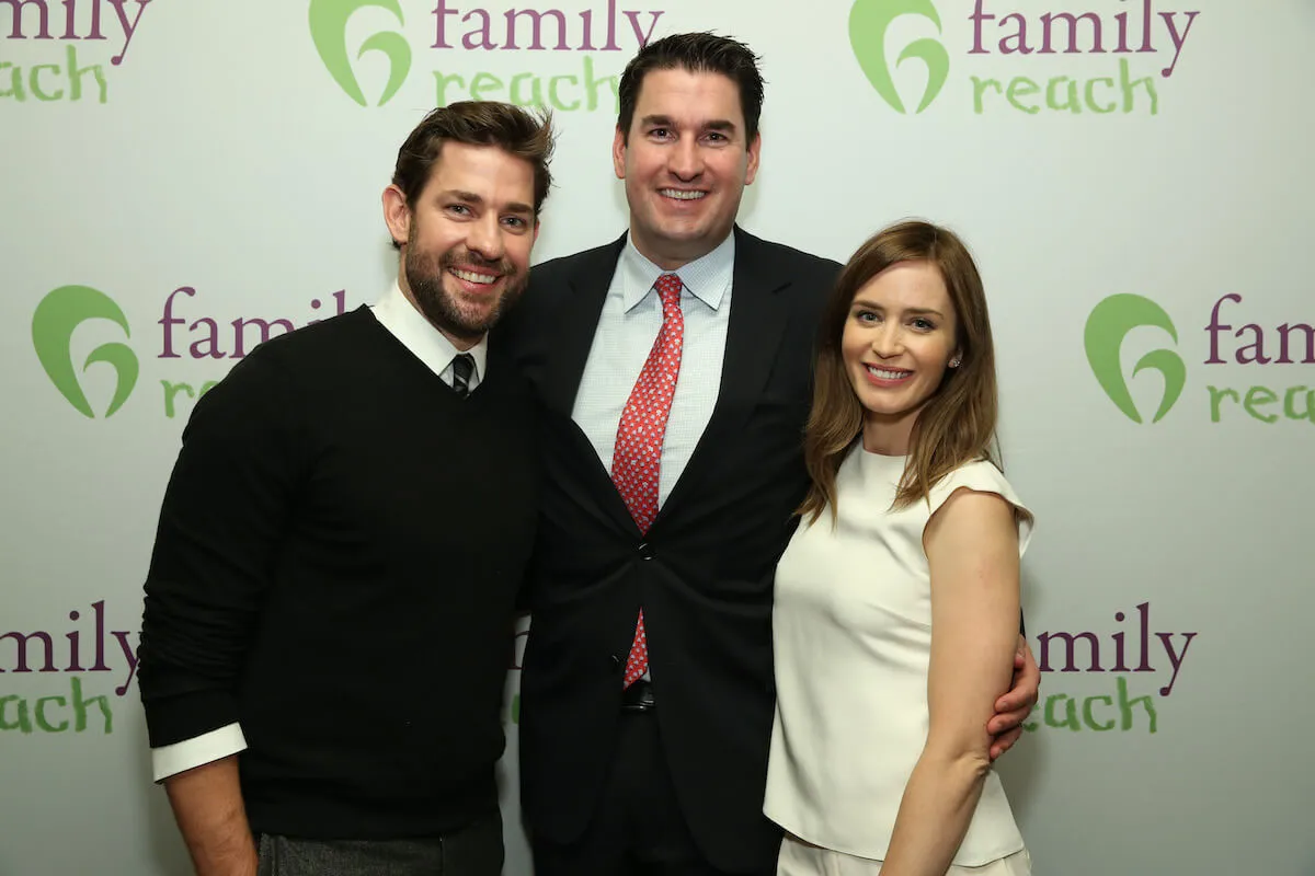 John Krasinski, Paul Krasinski, and Emily Blunt pose together. 