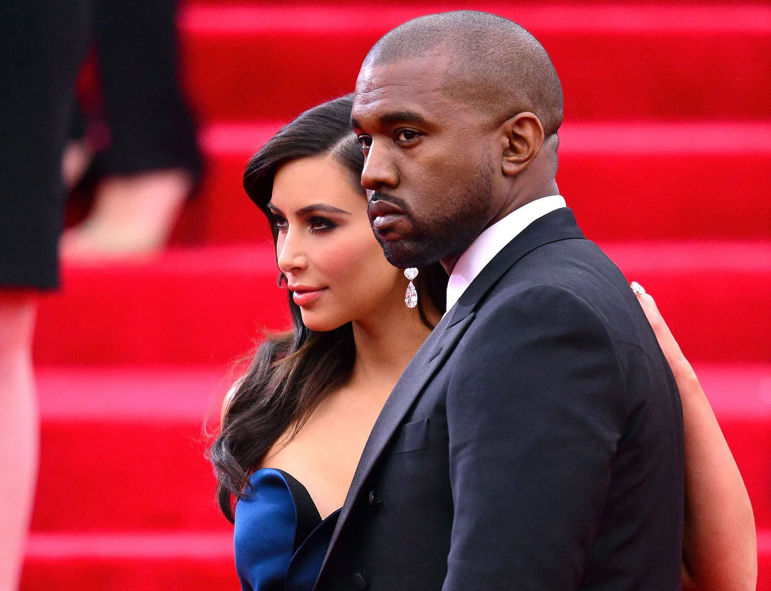 Kanye West and Kim Kardashian posing on the red carpet in 2014