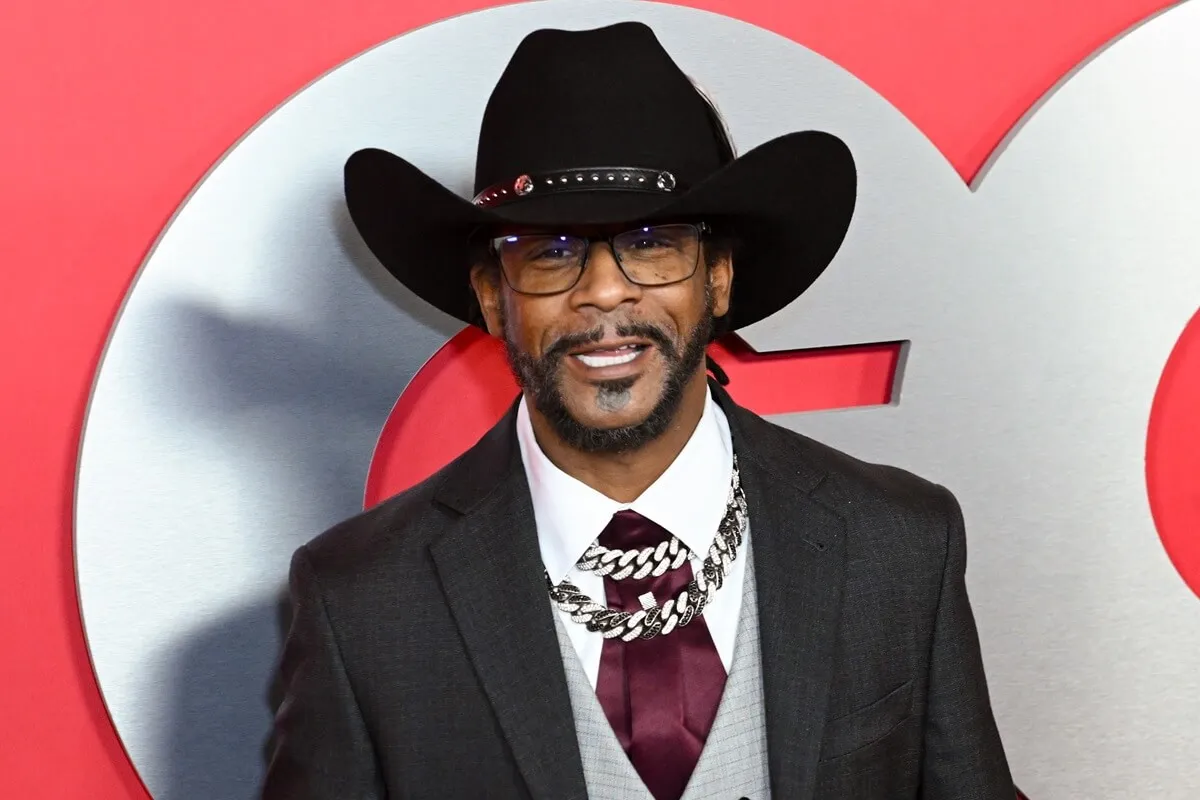 Katt Williams posing in a suit at GQ's Men of the Year Party.